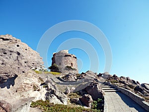 Italy, Sardinia, Portoscuso, promenade with view of the ancient Spanish watchtower