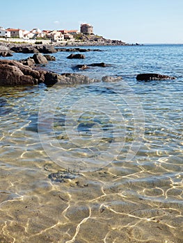 Italy, Sardinia, Portoscuso, promenade with view of the ancient Spanish watchtower