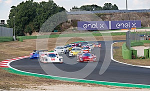 Race cars during formation lap on racetrack, prototype group of Le Mans series