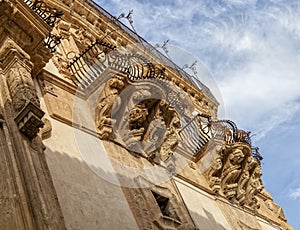 Italy, Sicily, Scicli Ragusa province, the Baroque Beneventano Palace facade, ornamental statues under the balconies