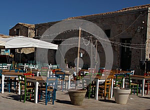 Italy, Sicily: Tables and Chairs in Marzamemi.
