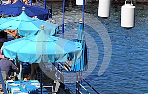 Italy Sorrento - a jetty with blue sunshades