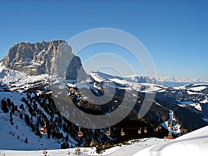 Italy, Trentino, Dolomites, view of flat sauce, Sasso Piatto, and cable car on the ski slope photo