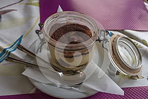 Italy, Varenna, Lake Como, a cup of Tiramisu on a table