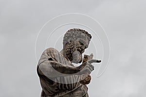 Close up view of Saint Peter the Apostle statue in front of Saint Peter`s Basilica, Piazza San Pietro, Vatican city state, Italy