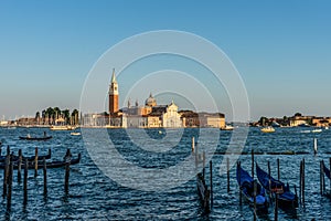 Italy, Venice, Church of San Giorgio Maggiore, BOATS IN SEA WITH BUILDINGS IN BACKGROUND