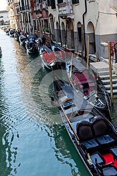 Italy, Venice, Gondola, BOATS MOORED IN CANAL