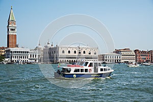 ITALY. VENICE - June 20, 2017: pleasure boats floating on the background of the bell tower of St. Mark`s Cathedral and the Palazzo