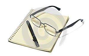 Items for the office, still life, Glasses, modern pair of glasses, black rim, note pad, pen