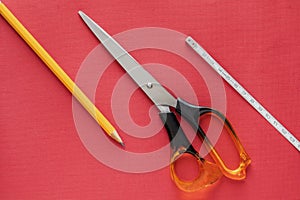 Items of stationery on a red background