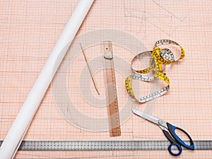 Items to draw a clothing pattern on graph paper