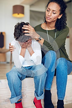 Itll be okay my son...a mother comforting her little son at home.