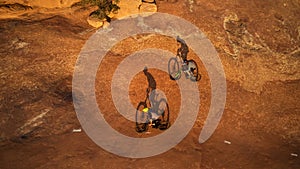 Its all about the journey. High angle shot of two young male athletes mountain biking in the wilderness.