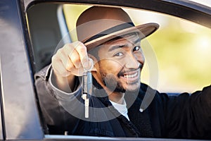 Its all the wild stuff that happens along the way. Shot of a young man showing the keys to his car.