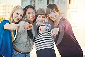 Its all about you. Portrait of a group of women pointing their fingers at the camera together.