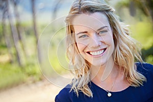 Its been a blissful weekend so far. Portrait of a beautiful young woman enjoying a day outside.