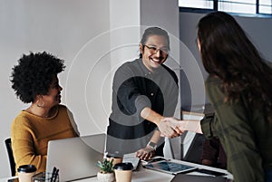 Its been a pleasure doing business with you. Cropped shot of a group of young businesspeople greeting each other with a