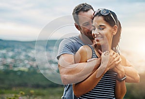 Its a day dedicate to love. a young couple in a loving embrace outdoors.