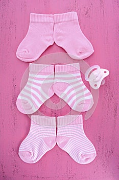 Its a Girl Baby Shower or Nursery concept with socks on pink woo