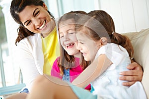 Its just the girls this afternoon. A mother and her two daughters sharing a laugh together on the porch.