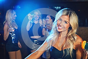 Its ladies night. a young woman partying in a nightclub.