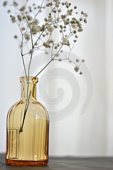 a glass bottle of flower photo