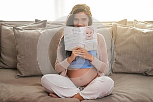 Its a must read for an expectant mother. Shot of a young pregnant woman reading a baby book at home.