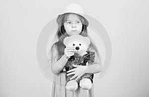 Its my toy. Small child cuddling teddy bear toy. Adorable girl child with cute stuffed animal doll. Little girl holding