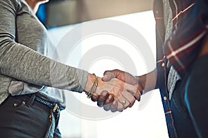 Its nice to make your acquaintance. Closeup shot of businesspeople shaking hands in an office.