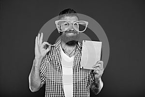 Its ok. Study nerd inviting for reading book. University male student with lecture notes. Bearded man in party glasses