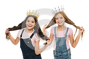 Its pride that drives them. Adorable little princesses in crowns with long hair source of their pride. Cute small girls