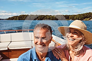 Its a vacation to remember. a mature couple enjoying a relaxing boat ride.