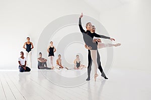 Its a wonderful thing to be able to dance. Studio shot of a young man and woman performing a ballet recital against a