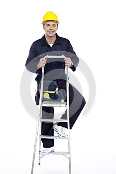 Its work time. Repairman climbing stepladder