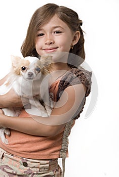 Ittle girl holding chihuahua puppy