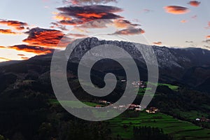 Itxina mountain with Zaloa and Urigoiti villages at sunrise photo