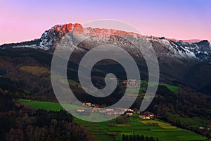 Itxina mountain with Zaloa and Urigoiti villages at sunset photo