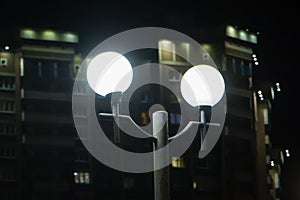 Ð¡ity street lights on the background of a residential building