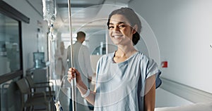 Iv drip, patient and portrait of happy woman in a hospital or clinic corridor with treatment for recovery from surgery