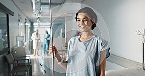 Iv drip, patient and portrait of happy woman in a hospital or clinic corridor with treatment for recovery from surgery