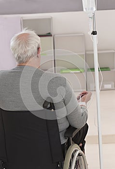 IV DRIP senior man in wheelchair