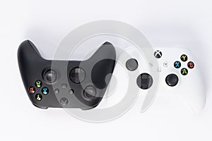 Ivano-Frankivsk, Ukraine August 14, 2022: Gamepad Microsoft Xbox Wireless Controller, two controllers black and white on