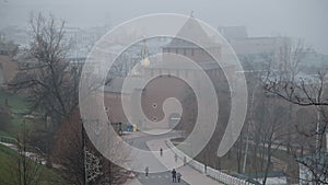 Ivanovskaya tower of the Nizhny Novgorod Kremlin in the thick November fog