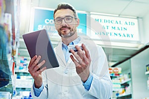 Ive found the perfect medication for you. Cropped portrait of a handsome mature male pharmacist working in a pharmacy.