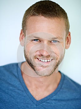 Ive got a reason to smile. Studio shot of a handsome young man posing against a white background.