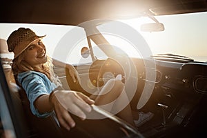 Ive got a tank full of gas to keep exploring. Portrait of a young woman enjoying a road trip along the coast.