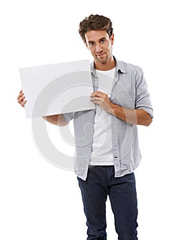 Ive got your copyspace right here. Portrait of a handsome young man holding a sign for your copyspace.