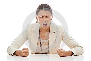 Ive had enough. A young businesswoman slamming her fists down in anger and frustration, isolated on white.