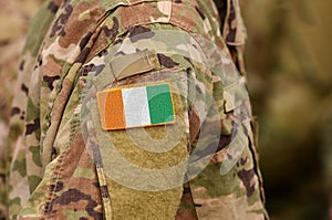 Ivory Coast or Cote d`Ivoire flag on soldiers arm. Ivory Coast o