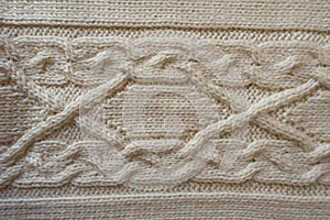 Ivory handmade knitwork with horizontal plait pattern